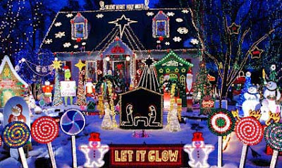 Festooned Christmas lights and figures on a house