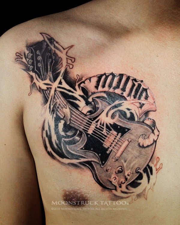 tribal guitar tattoo