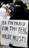 Islam is Peace: a Muslim woman (or cross-dresser) demonstrates in London in 2006