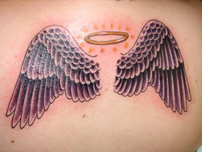 angel wing tattoo with a
