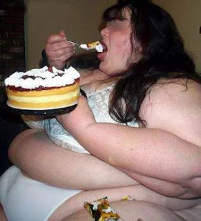 fat+woamn+eating+cake.jpg
