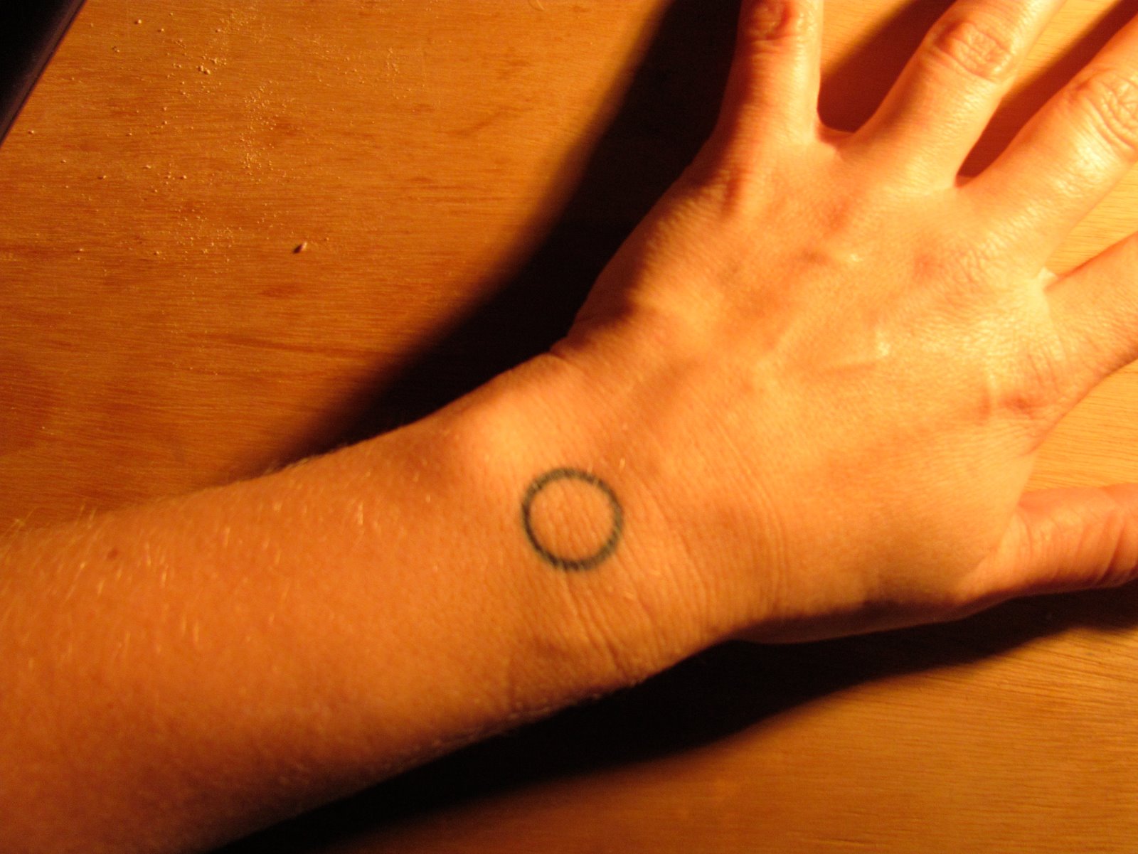Small Circle Tattoo