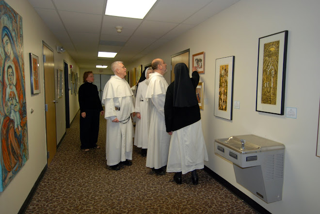Fr Carlos and Fr Ed looking at Sr Mary Grace's new gallery and gift shop