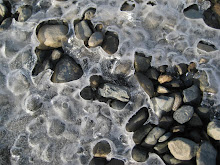 Ice with pebbles along a trail