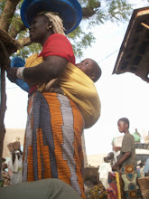 Woman and child in Malian marketplace