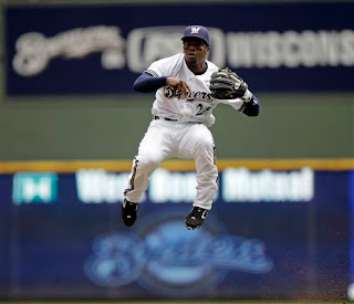 Weeks leaps sliding baserunners in a single bound