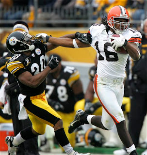 Joshua Cribbs delivers a nasty stiff arm