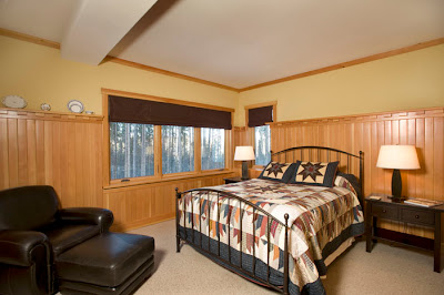 Conventional bedroom in timber frame home hybrid timber frame