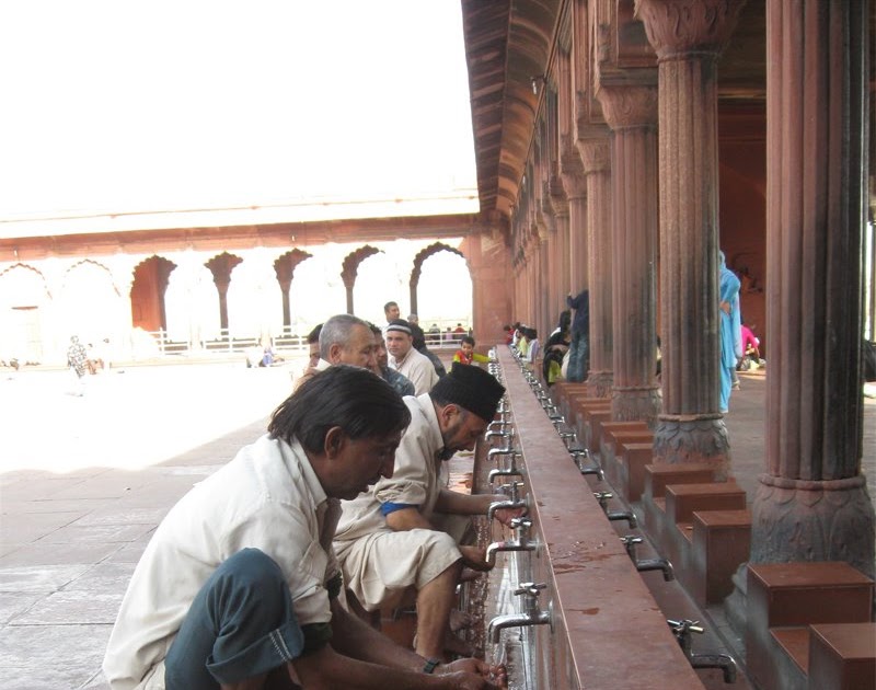 Washing Hands, Arms, Face, Feet Before Prayers At Jama Masjid