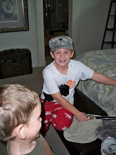 Christian loves to put on Boyd"s army hat!