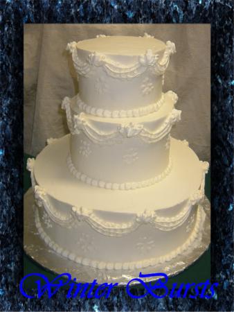 Winter Bursts Cake Wedding cake is covered with buttercream icing and is 