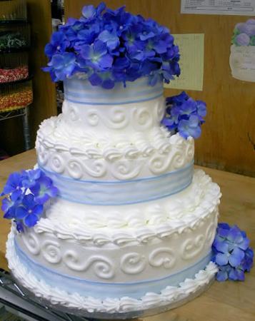 Hydrangea Wedding Cake Three tier round cake with swirls decoration and 