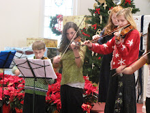 Three kids on their violins