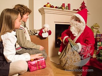 Santa Claus giving gifts to children hot photo