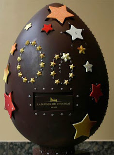 Huge and giant chocolate Easter Egg designed with big and small colorful stars hot image easter week celebration pics