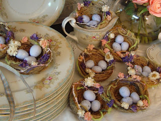 Easter eggs in Nests nicely decorated on table at plates for delicious Easter dinner hot picture