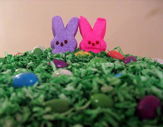 Easter funny cake with Two bunnies, one blue bunny and one pink bunny green hot image