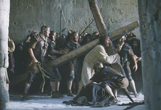 Jesus Christ bend down while carrying cross movie photo