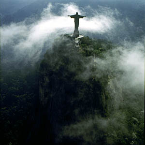 Christ the redeemer statue in Brazil with nature clouds photo