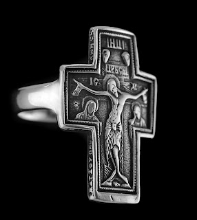 Silver Christianity ring with Jesus Christ on cross picture with black background for religious and spiritual purpose