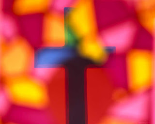 Christian Cross with beautiful red,pink, yellow colors background photo