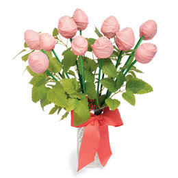 Strawberries dipped in pink candy coating made into a flower bouquet