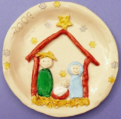 Clay plate featuring nativity scene of Jesus, Mary and Joseph surrounded by stars
