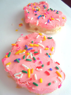 English Muffin with pink cream cheese and sprinkles