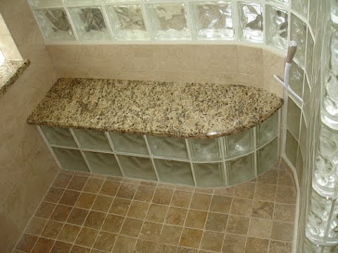 Shower with glass block enclosure and seat