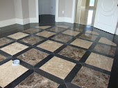 Light and dark emperador marble in wood floor inlay.