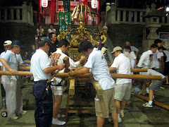 Men tying up the bamboo poles