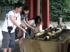 Worshipers wash at font "temizuya"