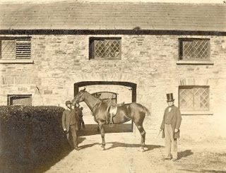  Stables at Kilrush House. Johnny Byrnes holding a horse at the stables of Kilrush House with Col Crofton Moore Vandeleur on the right. 1860