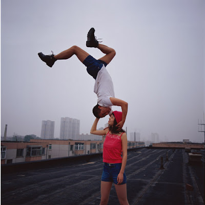 Lei Wei photo, man kissing a woman upside down