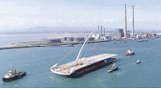 The Samuel Beckett Bridge arriving at Dublin Port