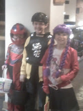 here are the three kids dressed up as hannah montana, a knight, and motorcrosser