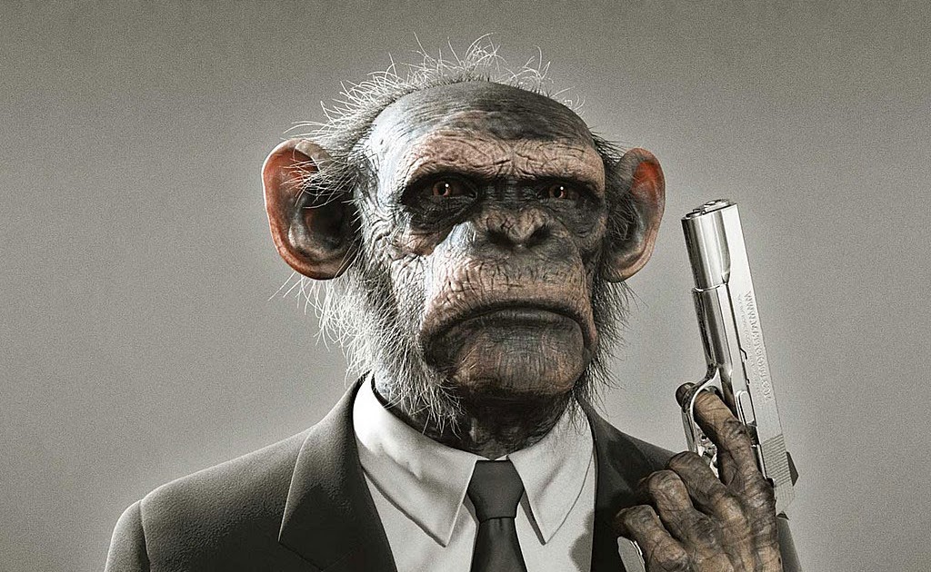 THAT's PRETTY COOL MONKEY IN SUIT HOLDING GUN.
