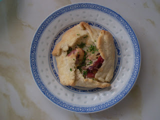 A free-form, savoury tart filled with ham hock, swiss cheese, and mustard