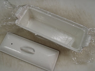A ceramic terrine, lined with plastic wrap