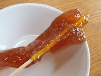 The maple taffy on a wooden stick