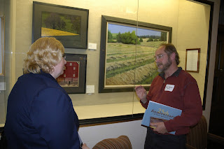 Capital Press Executive Editor Elaine Shein talks with artist Roy 'Brizz' Meddings at Oregon State University's Memorial Union.