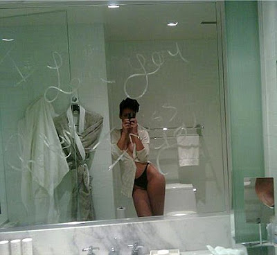 Leaked scandal pictures shows resembling Rihanna in front of a mirror