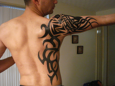 back tattoos for guys. tribal ack tattoos for men.