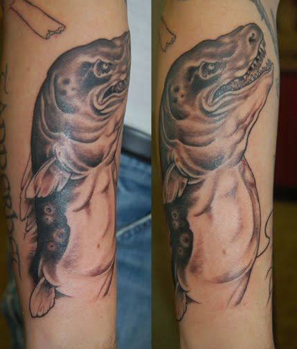 Here's Jörmungandr, Thor's enemy. It wraps around his forearm,