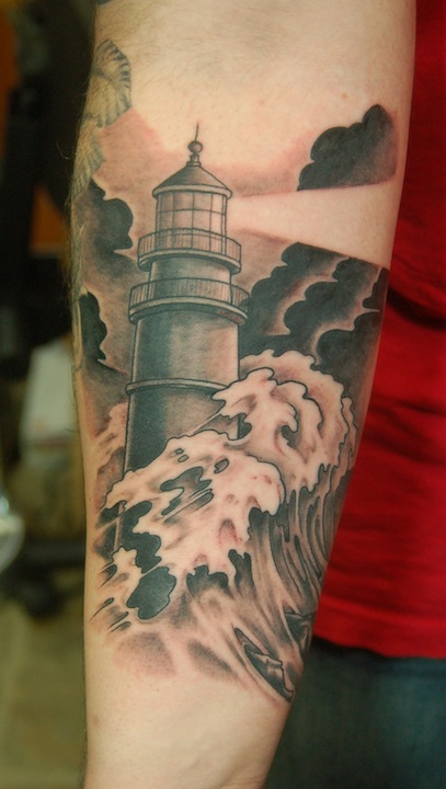 Here's Tony's new stormy lighthouse tattoo.