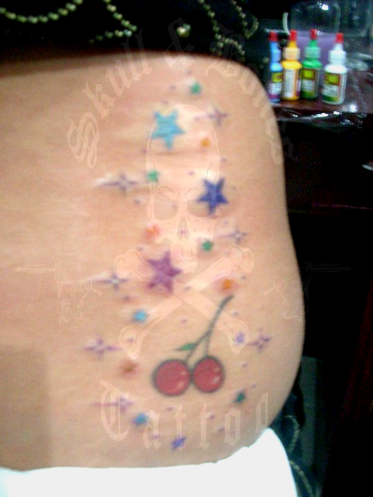 Stars and Cherries. Colored stars and cherries tattoo by Francis Field. click on picture for larger view. Posted by Skull and Bones Tattoo Philippines at 