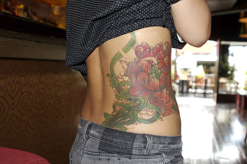 Tattooed Women Sidebody Flower Tattoo Design