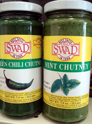Bottles of mint and green chili chutney