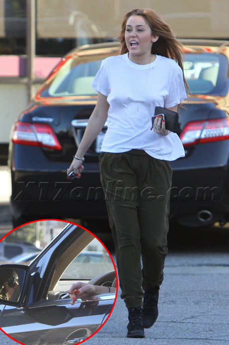 Miley Smoking Cigarette and New Tattoo. Miley Cyrus was spotted on Wednesday