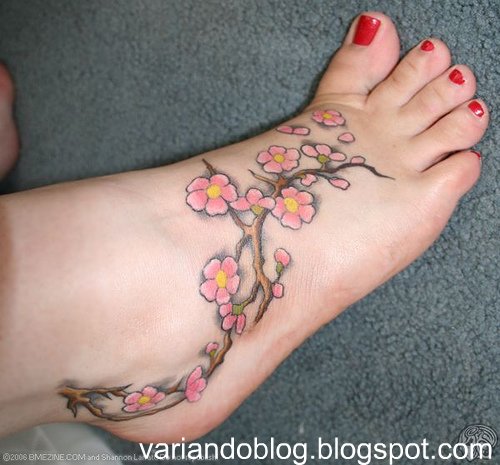 pretty foot tattoos. cherry blossom tree tattoo